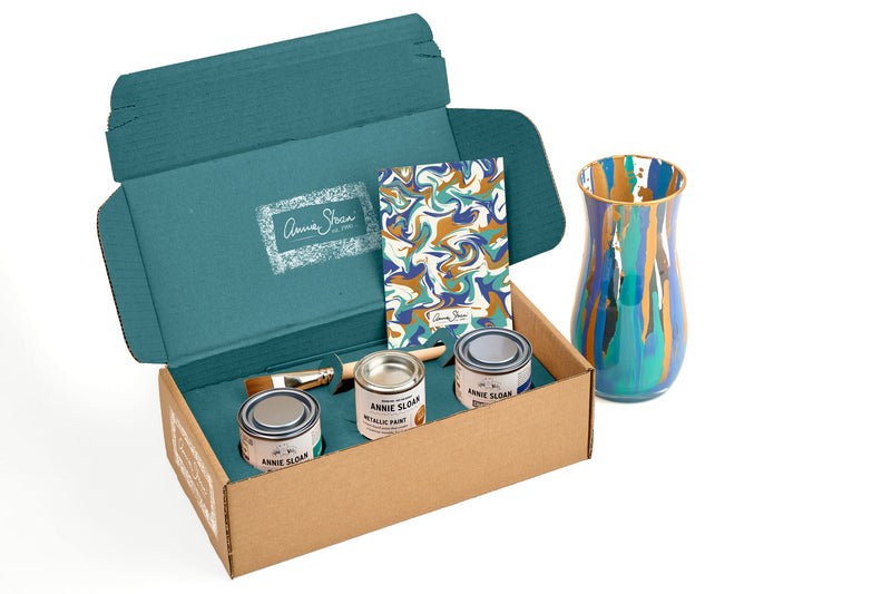 Unleash your creativity and create stunning Murano-inspired glassware with Annie Sloan’s expert guidance and a carefully curated selection of Chalk Paint™ colours.

The Murano Glass Gift Kit includes two of our bestselling cool-toned shades—Napoleonic Blue and Florence Chalk Paint™—along with an exclusive Gold Metallic Paint!